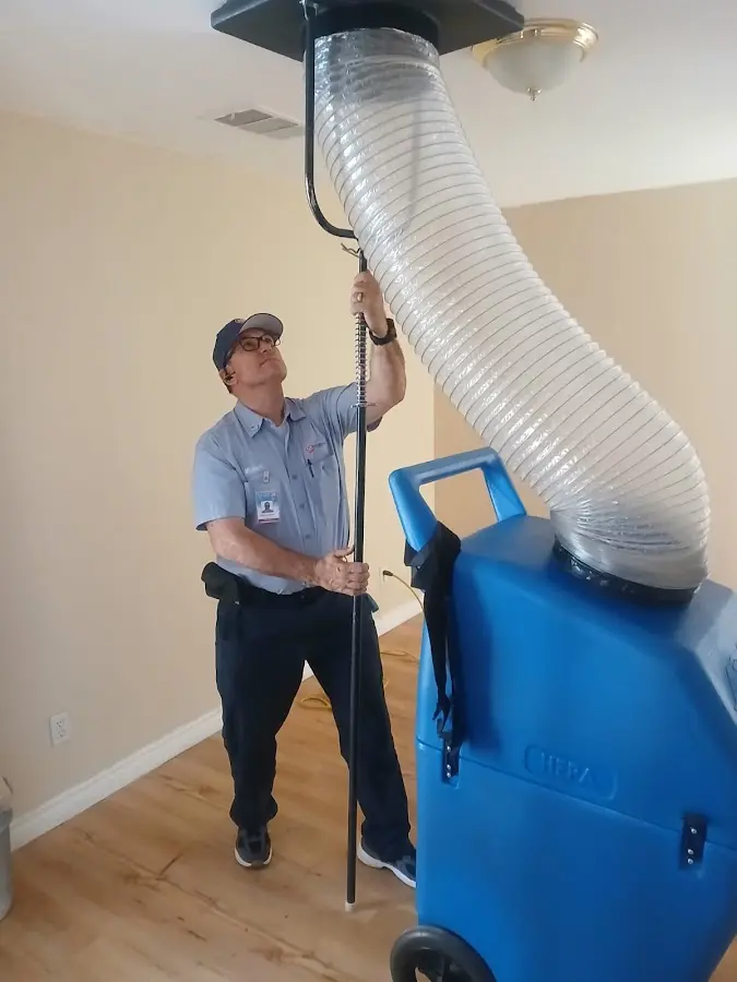 Furnace Tune-Up technician using HEPA equipment in Valdosta